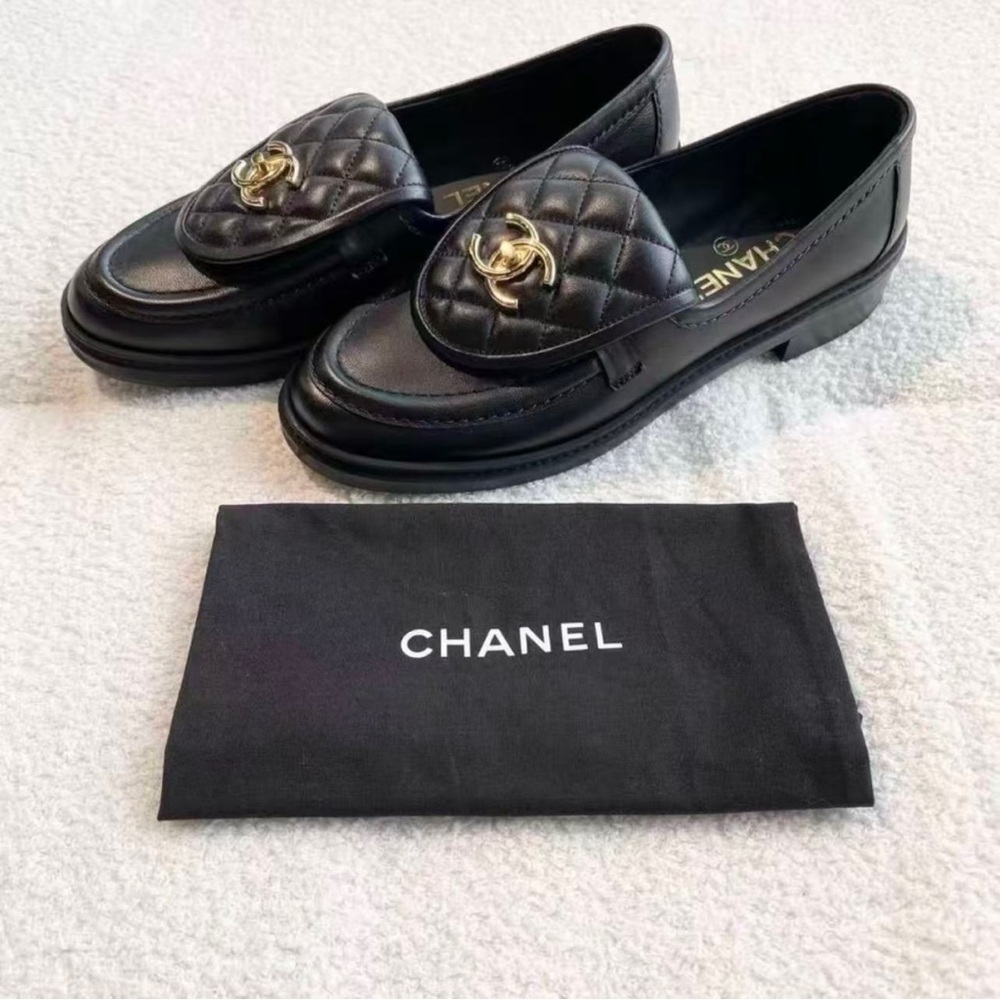 CHANEL Black Quilted Loafers with Gold Accent
